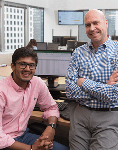 an lake forest college student with their supervisor at a business internship