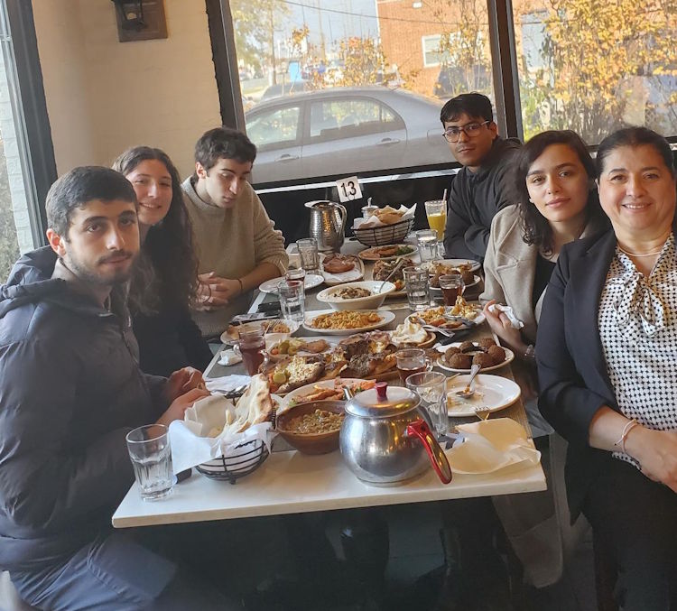 group of students and professor at lunch