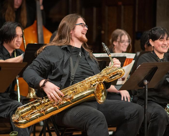 student playing alto sax