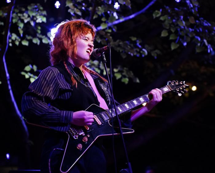 student shredding it on guitar