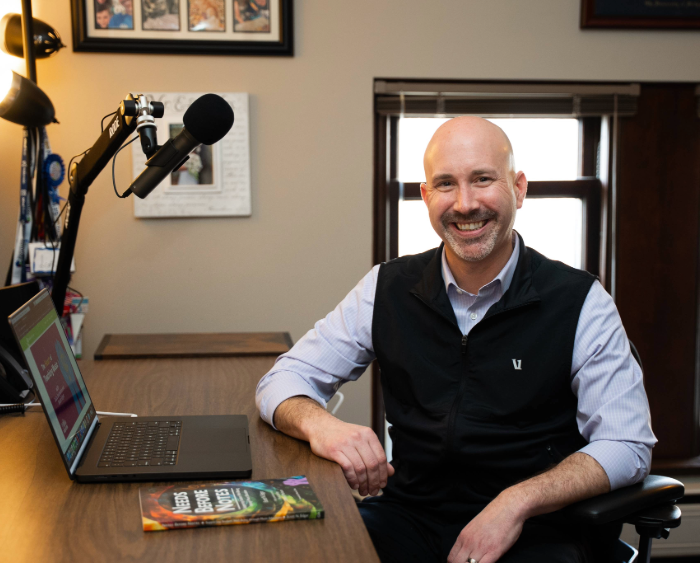 scott with podcast equipment