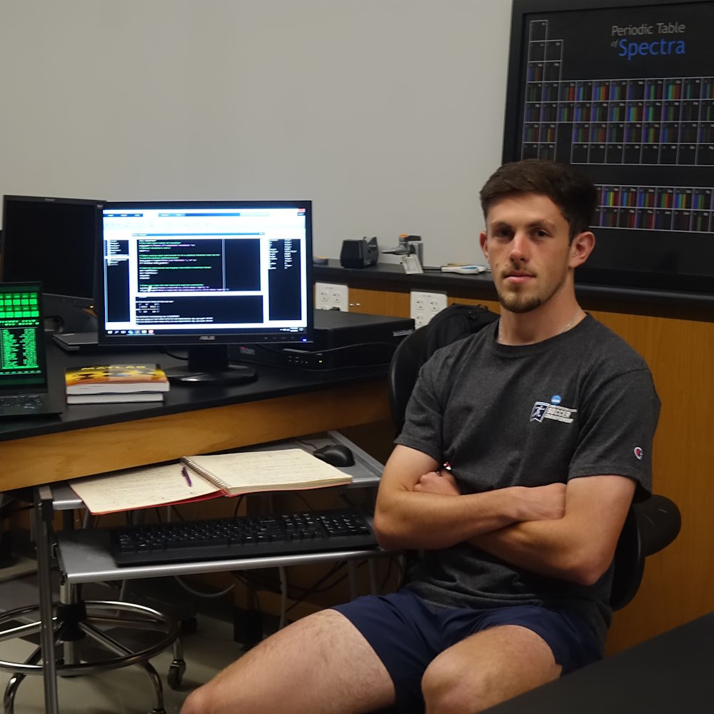 Peter Cirbo in a physics lab with computers