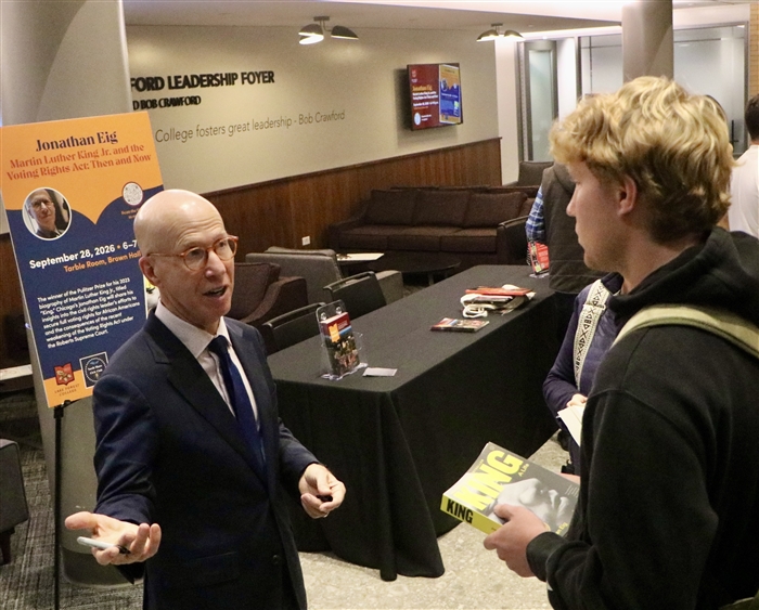 Eig talking with student