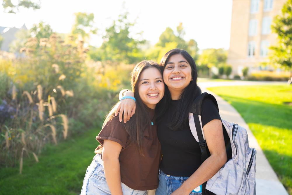students smiling on campus
