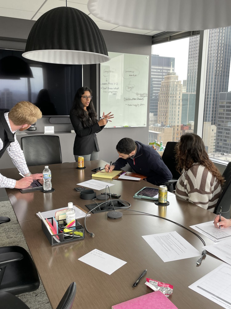 people in a boardroom working