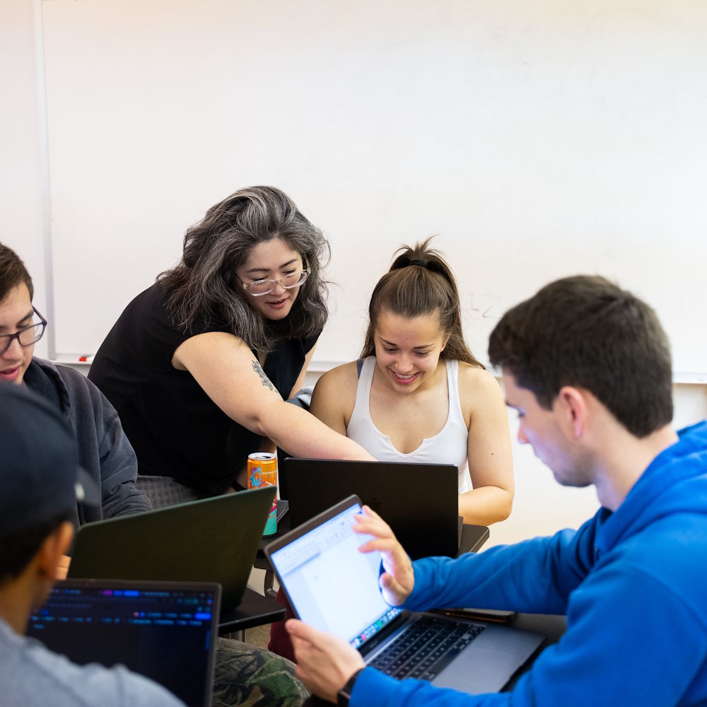 students and a professor having a discussion