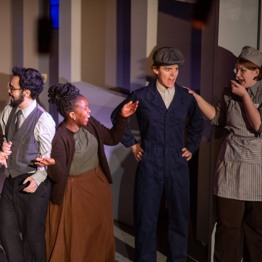 students on stage during a play