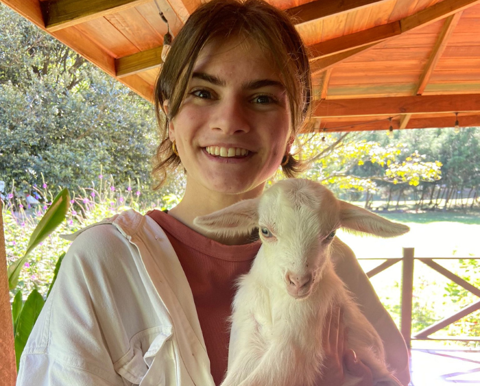 Isabella holding a five day old baby goat