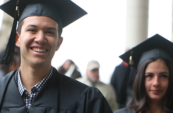 two people in graduation gowns and caps