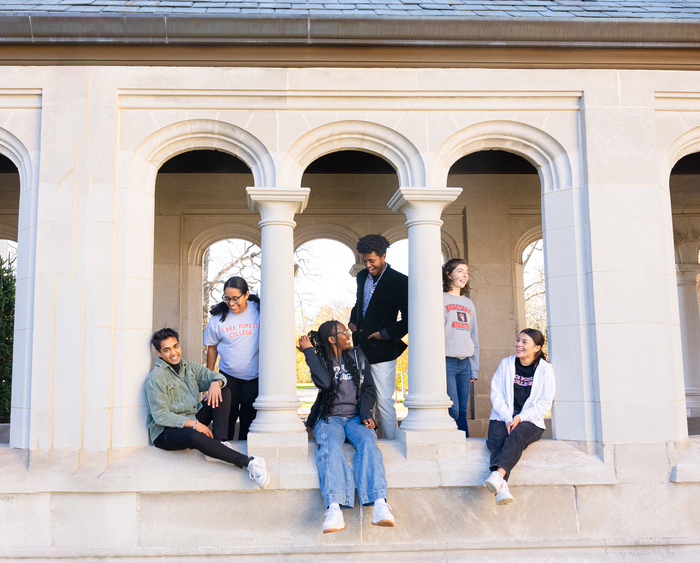students standing among columns in a breezeway