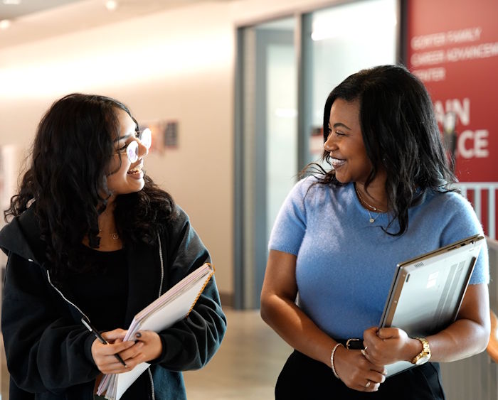 student and career counselor talking and smiling