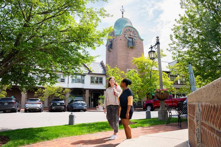 students in downtown Lake Forest in front of the clock tower