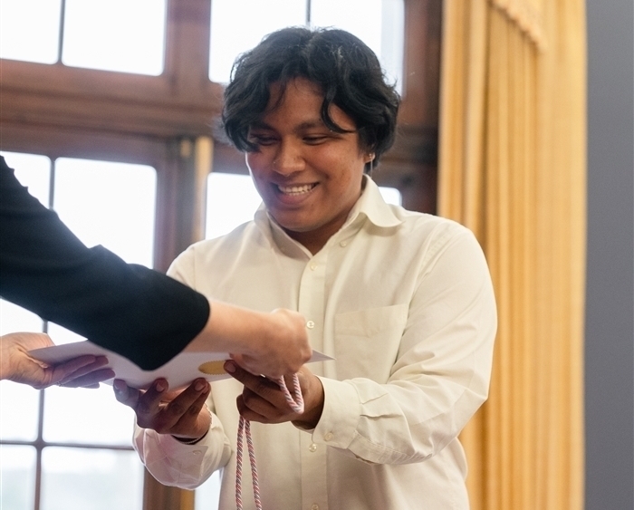 Student receiving award