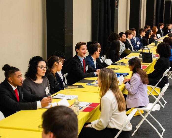 Students networking with professionals