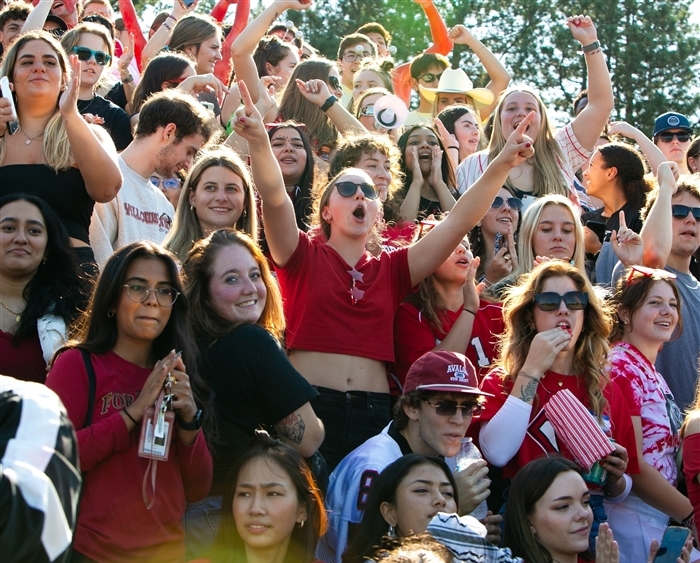 students cheering in football stands