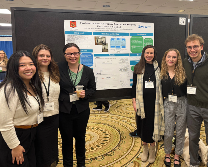 students and professor at conference