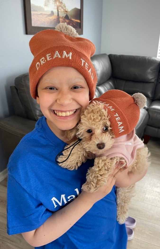 girl holding puppy