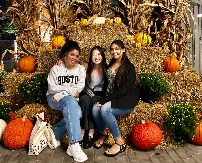 students at homecoming on hay bales