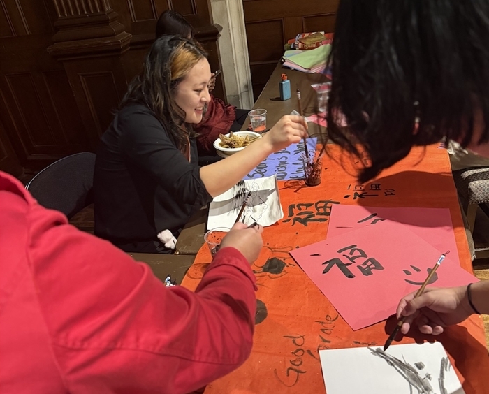 Students at calligraphy table