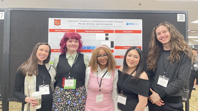 group of students presenting with carlson
