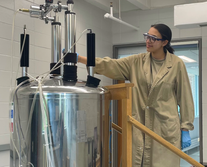 student using chem equipment