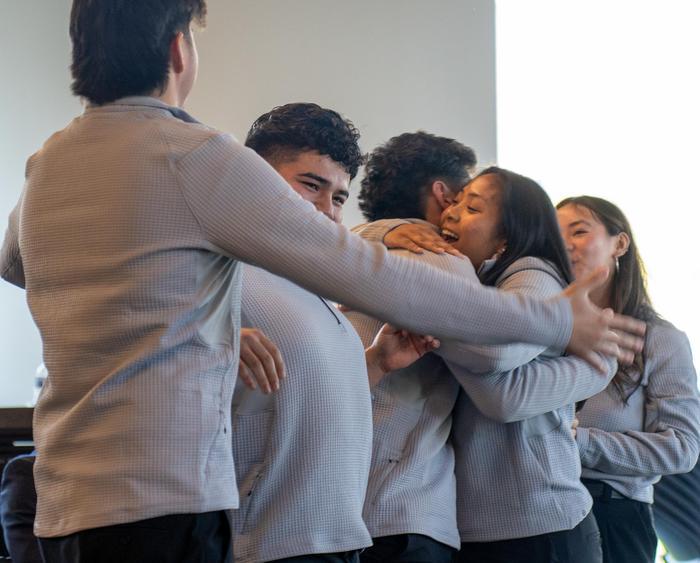 students hugging