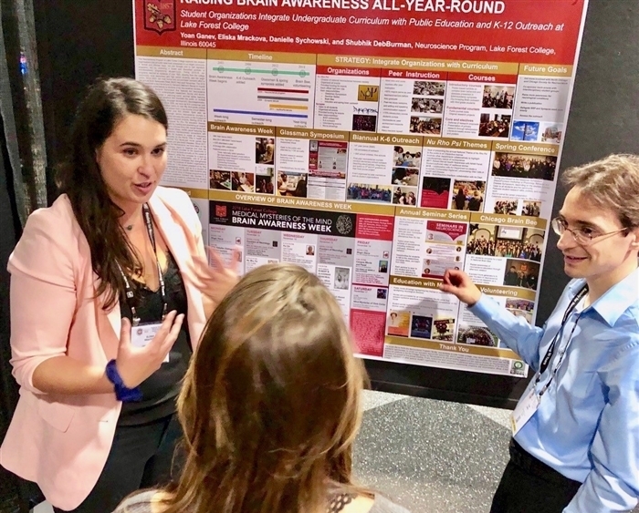 Students presenting science research poster